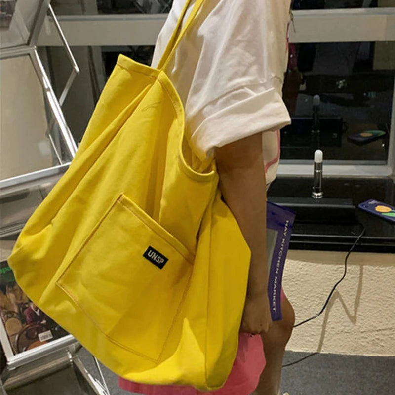 High Quality Reusable Canvas Shoulder Bag. Comes in Green and Yellow