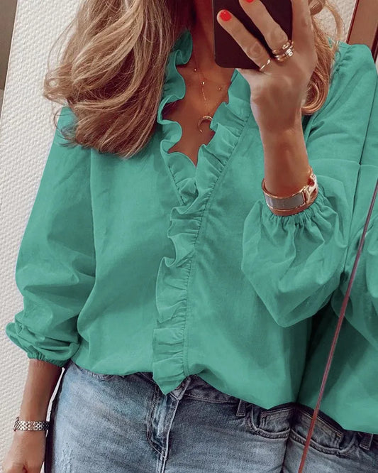 Available in 5 Solid colors Sizes to 2XL Long-sleeved ruffled front Pullover shirt