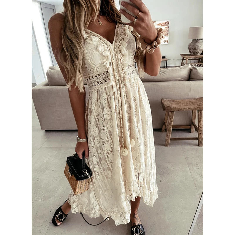 Retro Bohemian Lace, Sleeveless, V Neck, Flowy Ruffle Dress With Spaghetti Straps and Angled Hemline. Comes in Antique White and White