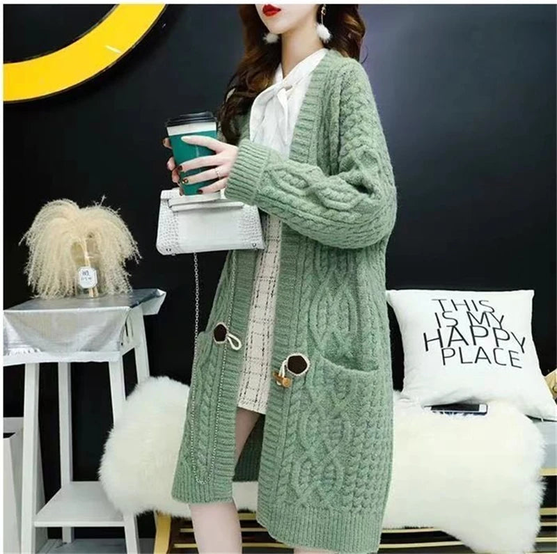 Cable Knitted Mid-Length Cardigan with Pockets and Two Large Black Buttons. Peach, Yellow, Off White, and Green