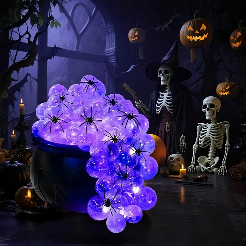 Indoor Halloween DIY Bubbling Witch Cauldron. Consists of 1 witch cauldron, cotton filling, 40 clear balls, and a string of twinkling lights, glue, and 10 simulated spiders.
