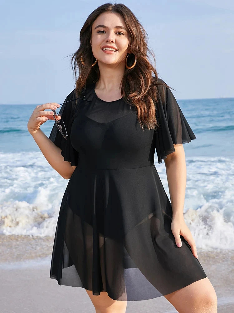 Sizes to 6 XL. One Piece Tummy Control Swimdress Solid Mesh, Ruffle Sleeved Cover Up in Blue, Black, and Burgundy