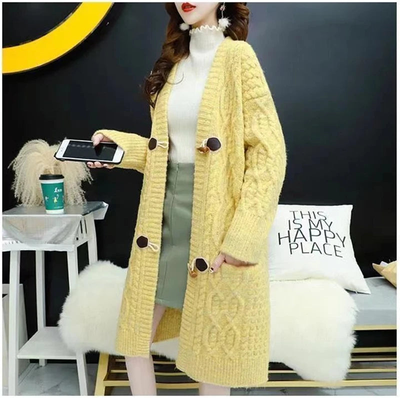 Cable Knitted Mid-Length Cardigan with Pockets and Two Large Black Buttons. Peach, Yellow, Off White, and Green