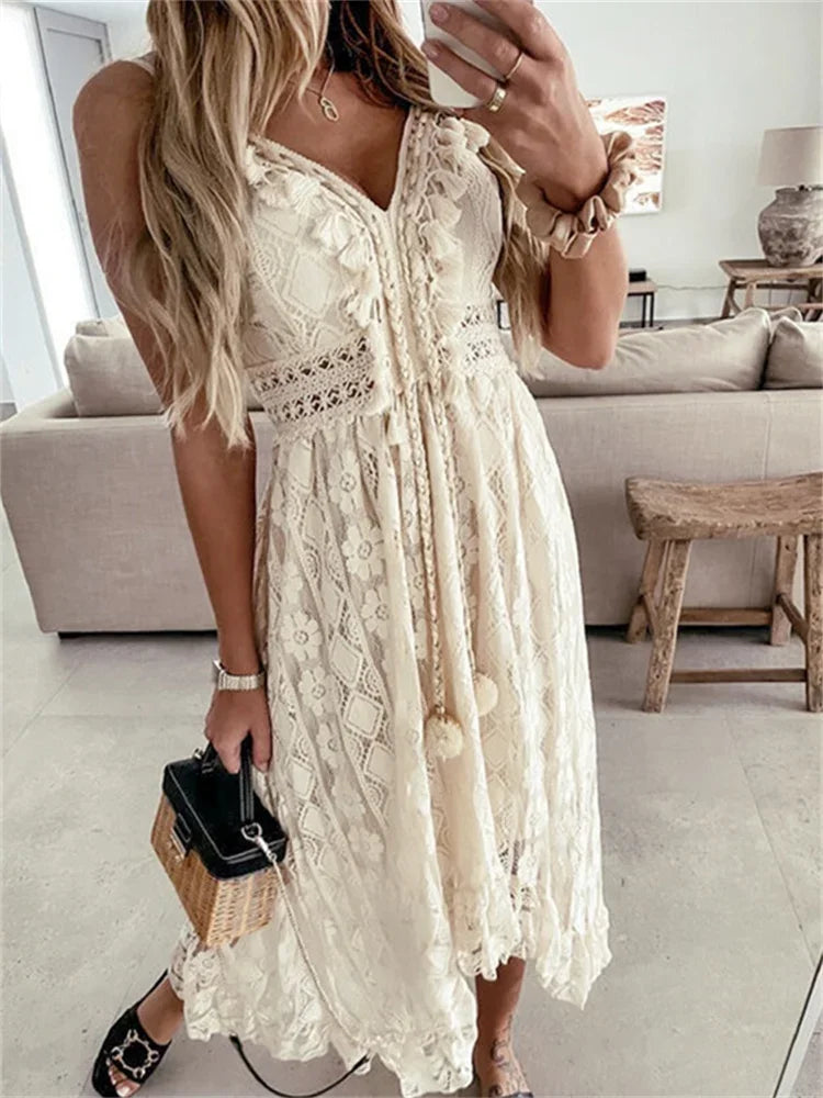Retro Bohemian Lace, Sleeveless, V Neck, Flowy Ruffle Dress With Spaghetti Straps and Angled Hemline. Comes in Antique White and White