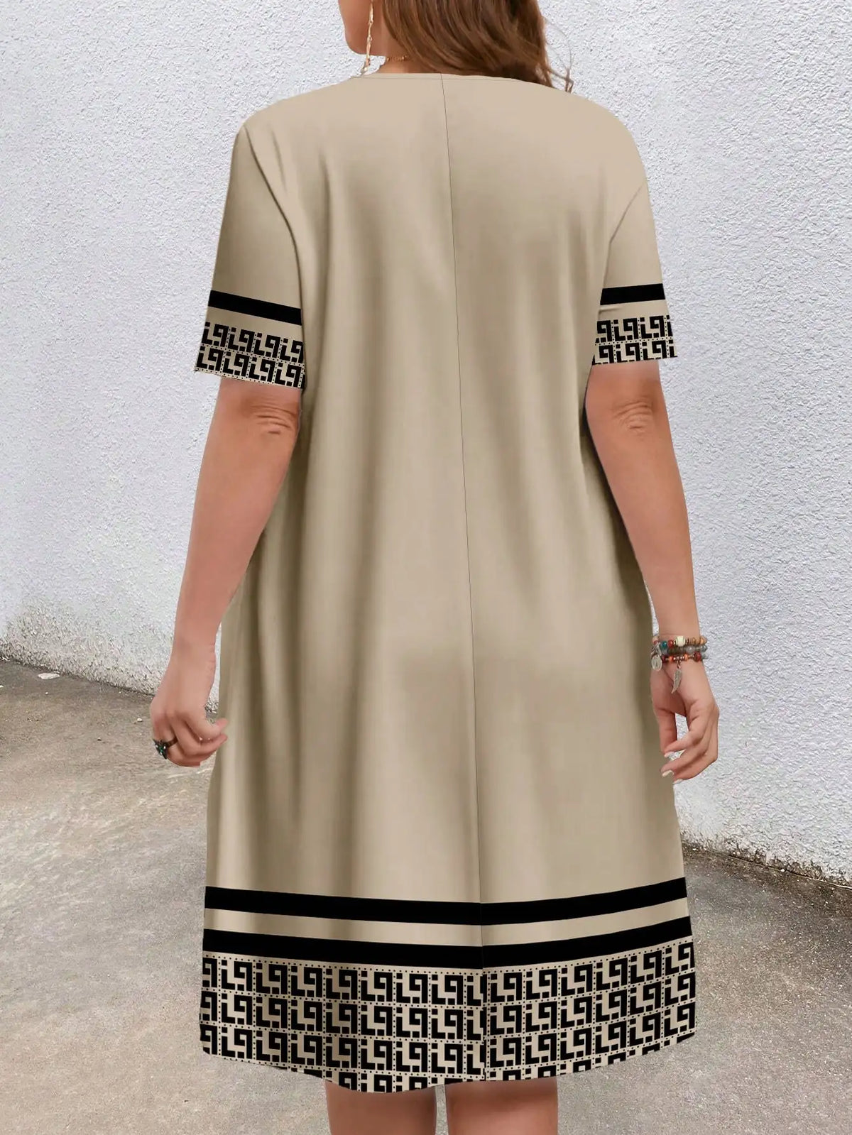 Sizes to 5XL, short-sleeved, round-neck, geometric ethnic borders, loose fit with pockets
