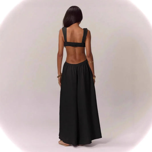 Elegant Jumpsuit in a variety of colors. Sides and back out, straps that connect on the Open backside. Large skirt-like pants. Remarkable design