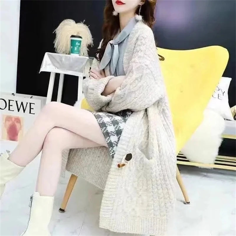 Cable Knitted Mid-Length Cardigan with Pockets and Two Large Black Buttons. Peach, Yellow, Off White, and Green