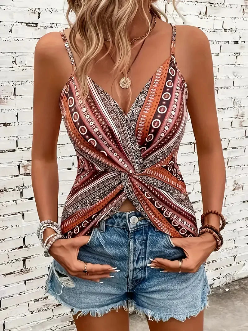 V-neck twisted front camisole top. Made of polyester fabric with spaghetti straps.  Available in 7 colors