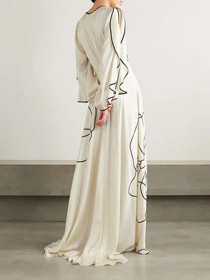 Boho Floor Length Evening Dress, Round Neck, Open Ruffled Sleeves trimmed in Black, Dress has an artistic Black on White Floral Design
