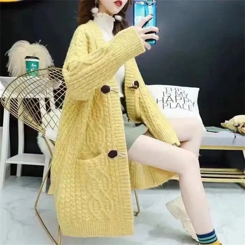 Cable Knitted Mid-Length Cardigan with Pockets and Two Large Black Buttons. Peach, Yellow, Off White, and Green