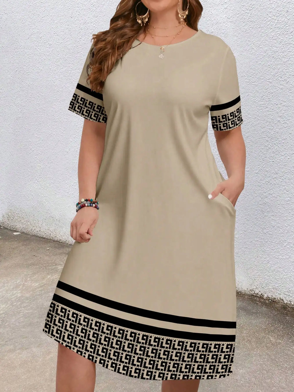 Sizes to 5XL, short-sleeved, round-neck, geometric ethnic borders, loose fit with pockets
